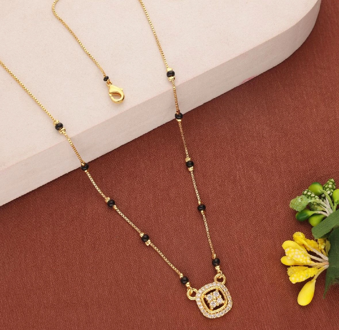 Elegant Gold Plated Mangalsutra with Circular Motif Pendant and Dual Black Bead Chain
